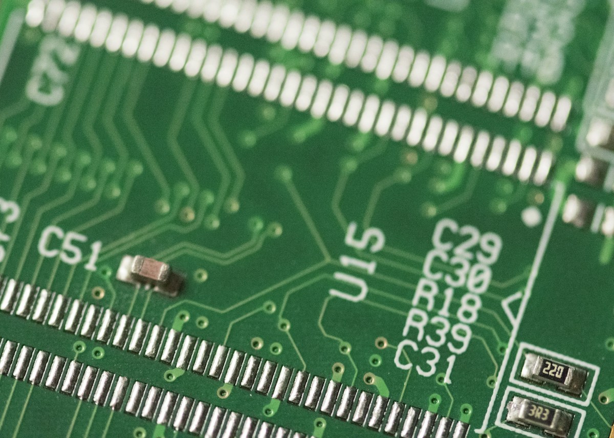 Close-up photograph of a green circuit board